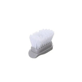 Tête e brosse disposée sur fond blanc.