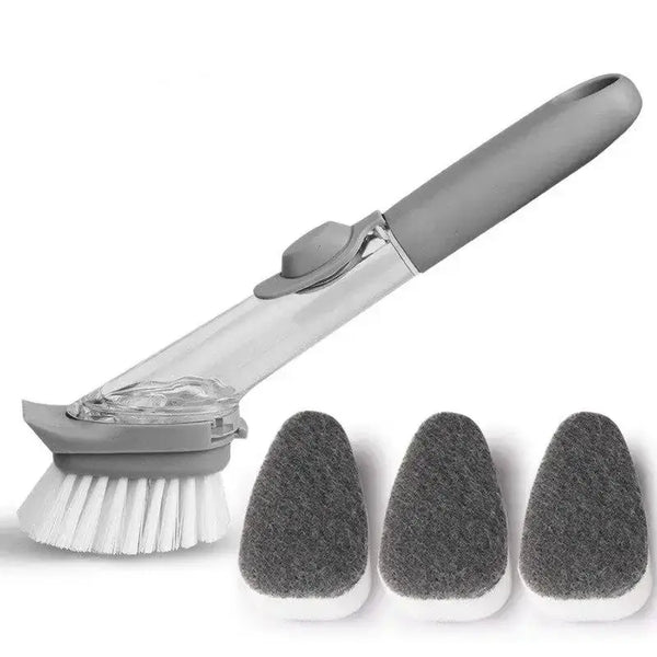 Brosse avec réservoir et ses têtes d'éponge à côté sur fond blanc.