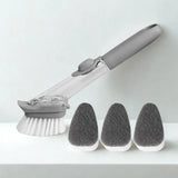 Brosse avec réservoir et ses têtes d'éponge à côté sur fond blanc.