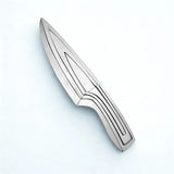 Couteau inox monobloc sur fond blanc