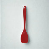 Cuillère rouge sur fond blanc