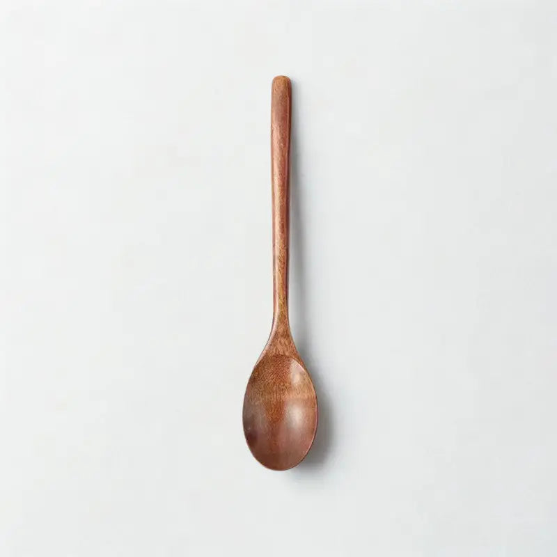 Cuillère bois foncé sur fond blanc