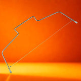 Découpe gâteau en acier inoxydable sûr fond orange