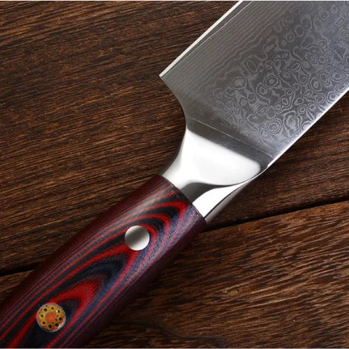 Couteau en damas au manche en bois de rose sur support en bois