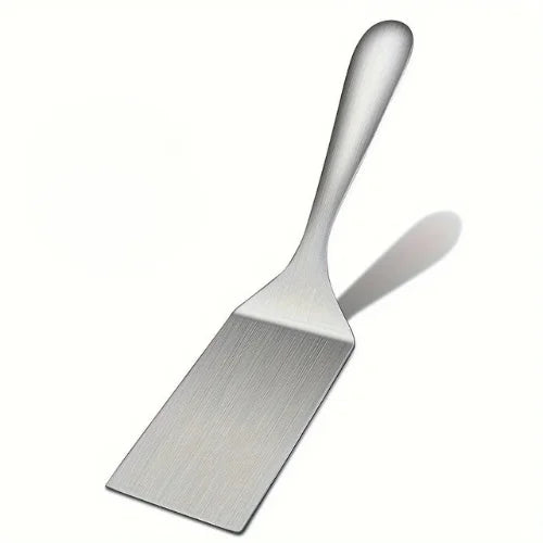 Spatule inox sur fond blanc