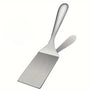 Spatule inox sur fond blanc