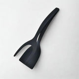 Spatule noire sur fond blanc