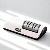 Aiguiseur électrique blanc et noir sur fond blanc